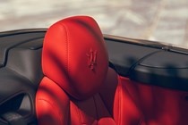 Maserati GranCabrio Trofeo review: headrest detail shot, red leather upholstery