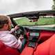 Maserati GranCabrio Trofeo review: interior driving shot, Piers Ward at the wheel, red leather upholstery