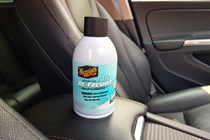 Meguiar's air con refresher on car armrest