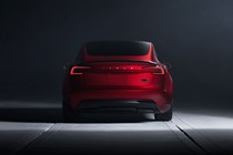 Tesla Model 3 Performance: rear static, low angle, red paint, studio shoot