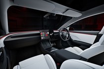 Tesla Model 3 Performance: interior, dashboard and infotainment system, white upholstery, studio shoot