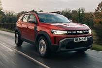 Dacia Duster review - front, red, driving