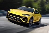 Lamborghini Urus driving front, yellow