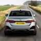 BMW 5 Series review: rear driving, low angle, matte grey paint