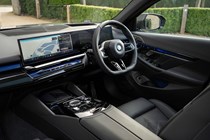 BMW 5 Series review: dashboard and infotainment system, black leather upholstery