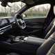 BMW 5 Series review: dashboard and infotainment system, from passenger seat, black leather upholstery