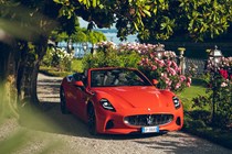 Maserati GranCabrio Folgore review: front three quarter static, flowers, orange paint