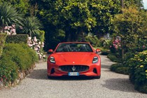 Maserati GranCabrio Folgore review: front static, lake in background, orange paint