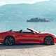 Maserati GranCabrio Folgore review: side view static, lake in background, orange paint