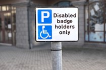 Image of a disabled badge holders only parking sign