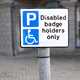 Image of a disabled badge holders only parking sign