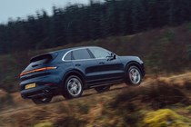 Porsche Cayenne review, Cayenne S V8, rear driving uphill off road, driving, blue