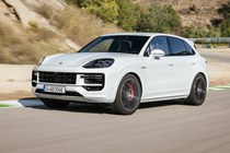 Porsche Cayenne review - 2023 facelift - Turbo E-Hybrid, white, front, driving on circuit