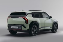 Kia EV3 (2024) reveal: rear three quarter static, low angle, green paint, studio shoot