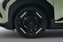 Kia EV3 (2024) reveal: alloy wheel detail shot, black paint, studio shoot