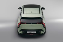 Kia EV3 (2024) reveal: rear static, high angle, green paint, studio shoot