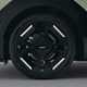 Kia EV3 (2024) reveal: alloy wheel detail shot, black paint, studio shoot