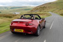 Mazda MX-5 Mk4 review - rear view, red, roof down, on road, driving