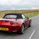 Mazda MX-5 Mk4 review - rear view, red, roof up, on road, driving