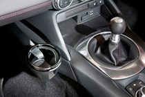 Mazda MX-5 review - interior, passenger cupholder mounted near gearlever