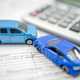 Toy cars on document - Reduce car running costs