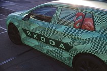 Skoda Elroq prototype: detail shot of doors and flamingo, green camo wrap