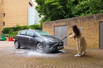 Paula Cullington cleans a grey car using the Bosch