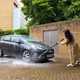 Paula Cullington cleans a grey car using the Bosch