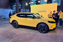 Ford Capri (2024) launch: front three quarter static, yellow paint, at launch event