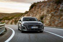 Audi A5 Sportback (2024): front three quarter driving, grey paint