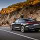 Audi A5 Sportback (2024): rear three quarter driving, grey paint