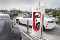 Tesla Supercharger, rear three quarter static, plugged in charging