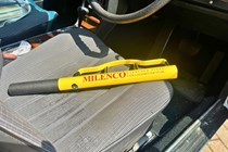 The Milenco HS Yellow Steering Wheel Lock on a car seat