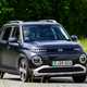 Hyundai Inster review, black, exterior, moving, front three quarters | Parkers