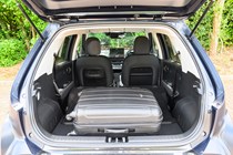 Hyundai Inster review, black, boot capacity, seats down, suitcase | Parkers