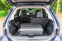 Hyundai Inster review, black, boot capacity, split seats down, suitcase | Parkers