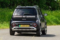 Hyundai Inster review, black, exterior, moving, rear three quarters | Parkers