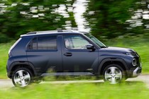 Hyundai Inster review, black, exterior, moving, side profile | Parkers