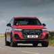 Audi Q7 (2025) review: front three quarter cornering, red paint