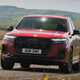 Audi Q7 (2025) review: front three quarter cornering, red paint, low angle