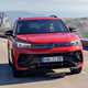 Volkswagen Tiguan eHybrid review - front, orange, driving round corner