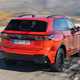 Volkswagen Tiguan eHybrid review - rear, orange, driving round corner