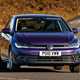 Volkswagen Polo (2024) review: front three quarter cornering, British road, close up, purple paint