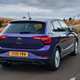 Volkswagen Polo (2024) review: rear three quarter driving, British road, purple paint