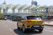 Volkswagen T-Roc driving, yellow, rear side