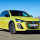 Peugeot e-208, green, driving, front three quarters