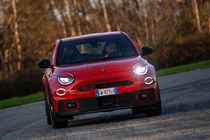 Abarth 600e (2024) review: front driving, orange paint