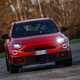 Abarth 600e (2024) review: front driving, orange paint