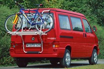 Image of Volkswagen T4 California camper van in red, rear view showing bike rack attached to tailgate