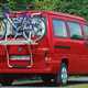 Image of Volkswagen T4 California camper van in red, rear view showing bike rack attached to tailgate